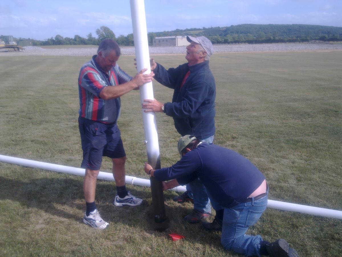 Mick Mulhall, Ollie Byrne and Sonny Keogh erecting the first golaposts in Rathleague, July 2010