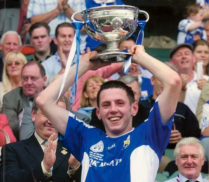 Portlaoise player and Laois captain Craig Rogers lifts the All-Ireland minor trophy in 2003.