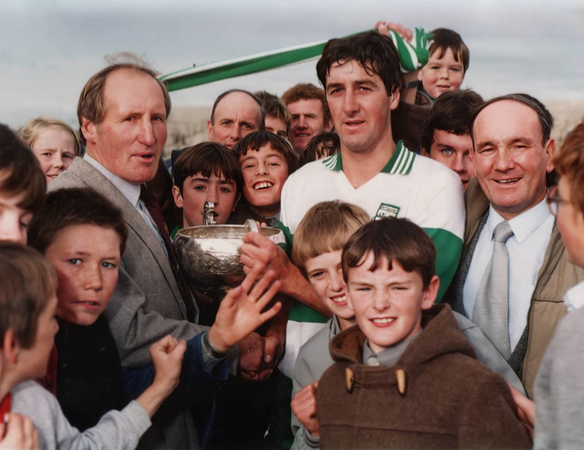 Billy Bohane receiving the senior hurling trophy on behalf of injured captain John Joe Ging.