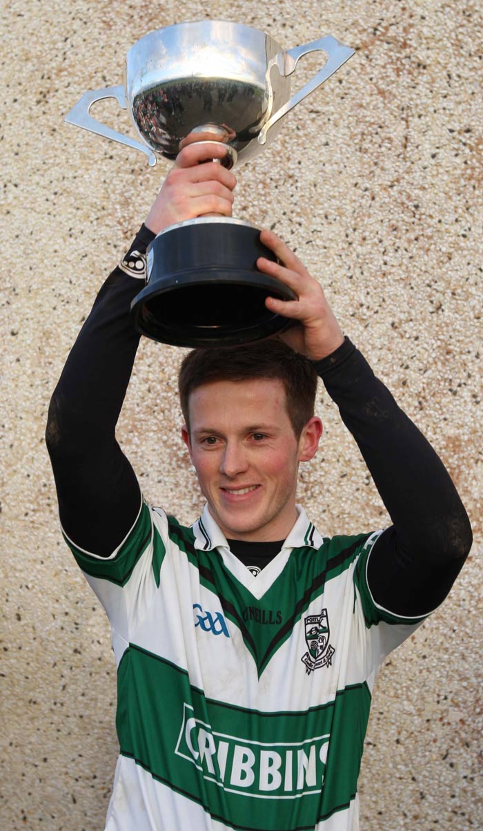 Peter McNulty raises the ACFL Division 1 trophy as captain in 2009.
